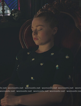 Britta's navy floral embroidered short sleeve sweater on Riverdale