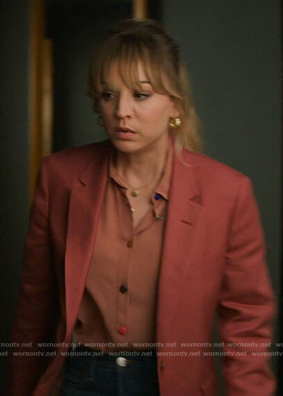 Cassie's pink blouse with multi color buttons on The Flight Attendant