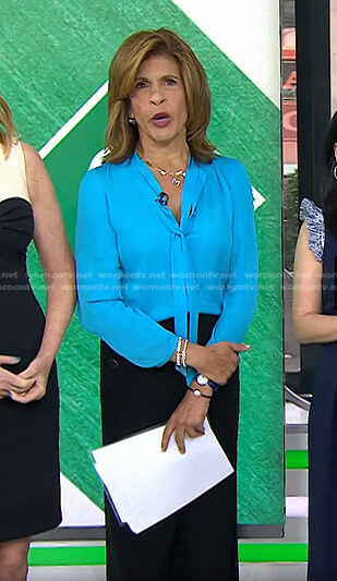 Hoda's blue tie neck blouse and black pants on Today