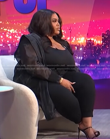 Nina's black organza jacket and track pants on E! News Nightly Pop