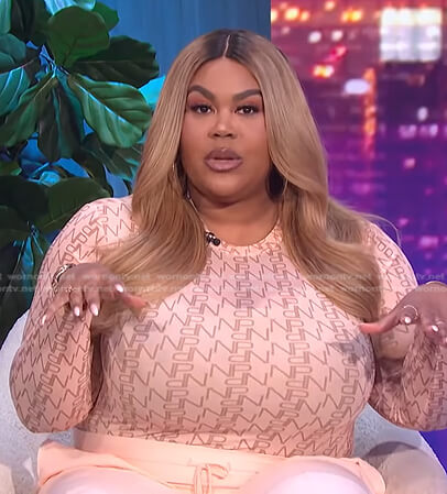 Nina's pink logo print top and wide-leg pants on E! News Nightly Pop