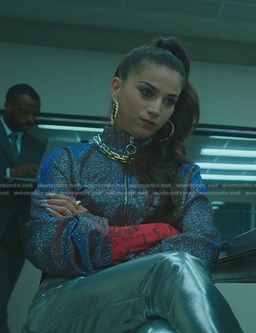 Rebe's red long sleeve top and glitter jacket on Elite