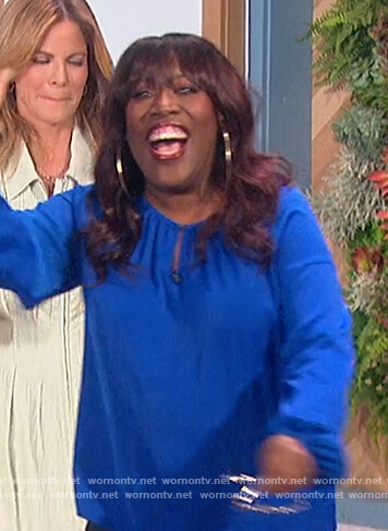 Sheryl's blue keyhole blouse on The Talk