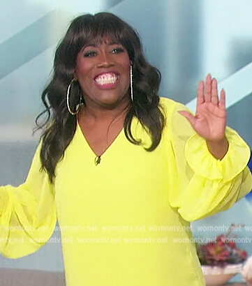 Sheryl's yellow v-neck top on The Talk