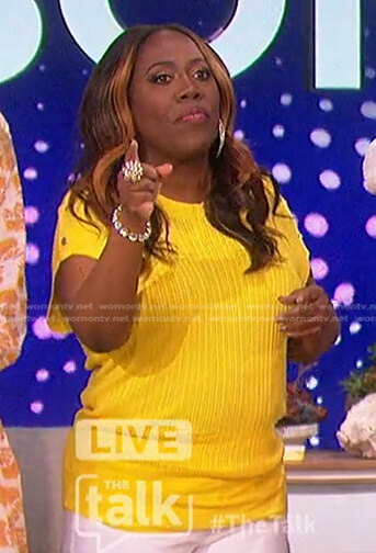 Sheryl's yellow button-shoulder top on The Talk