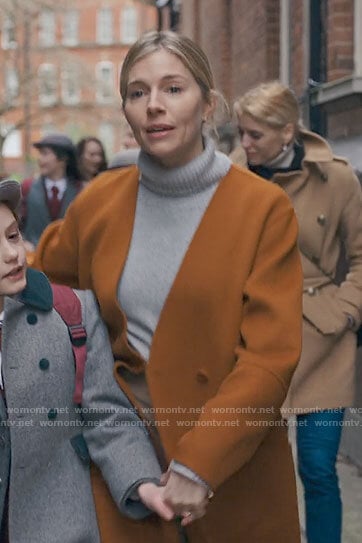 Sophie's orange coat on Anatomy of a Scandal