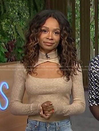 Zuri's beige cutout turtleneck sweater on Access Hollywood
