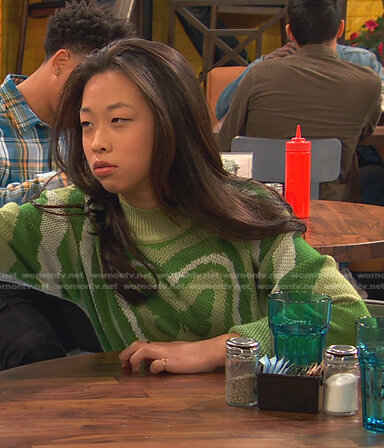 Ivy's green butterfly print sweater on Ravens Home