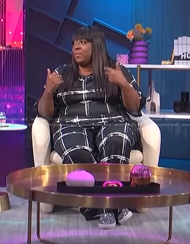 Loni's black windowpane check jumpsuit on E! News Nightly Pop