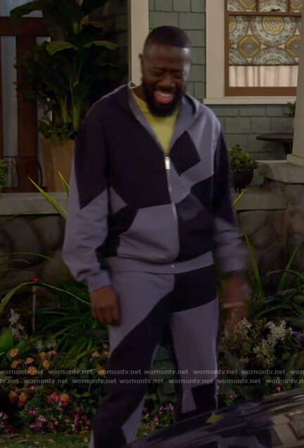 Malcolm's blue colorblock hoodie and sweatpants on The Neighborhood