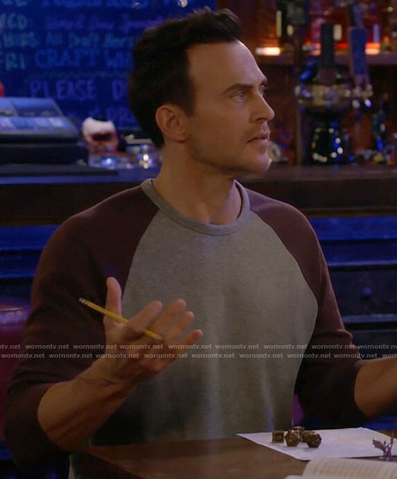 Max's grey shirt with purple sleeves on Call Me Kat