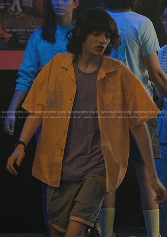 Mike's orange short sleeve shirt and grey shorts on Stranger Things