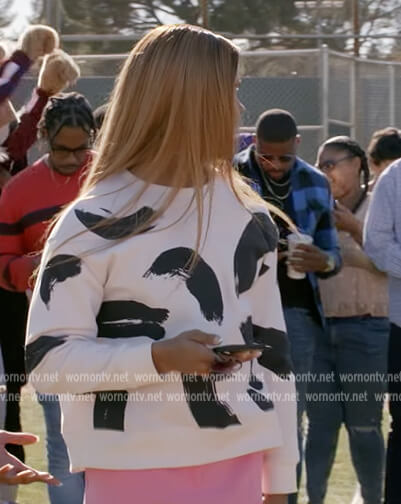 Nathaniel's white paint stroke print sweater on All American Homecoming
