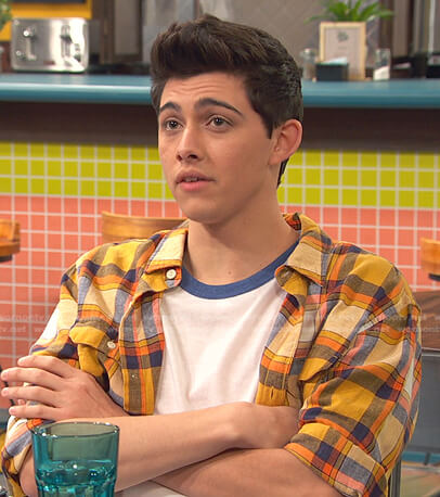 Neil's orange plaid shirt on Ravens Home