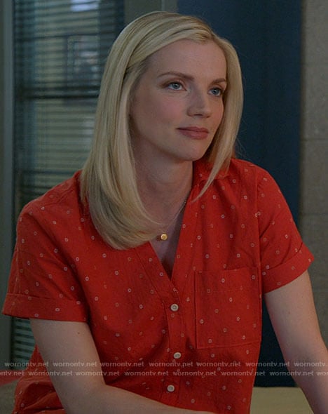 Sylvie's red short sleeve button down top on Chicago Fire