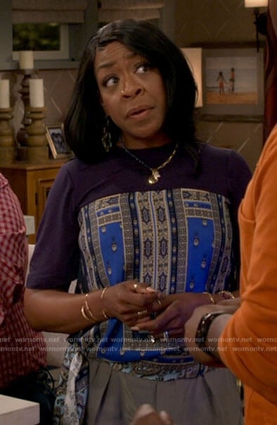 Tina's blue scarf print top on The Neighborhood