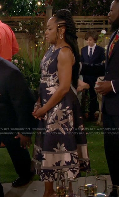 Tina's navy floral dress on The Neighborhood