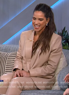 Adria Arjona's beige leather blazer and pants on The Kelly Clarkson Show