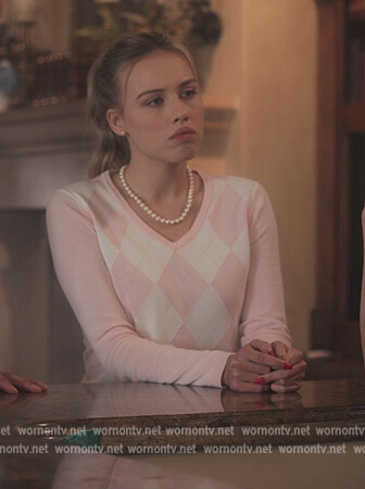 Elinor's pink argyle sweater on First Kill
