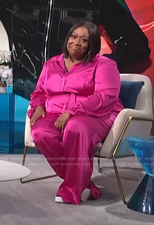 Loni's fuchsia satin jumpsuit on E! News Daily Pop