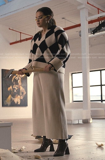 Mabel's checkered sweater and white ribbed pants on Only Murders in the Building