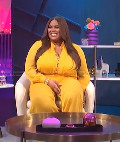 Nina's yellow button front jumpsuit on E! News Nightly Pop