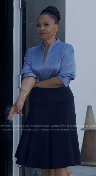 Patricia's blue satin split-neck blouse on I Love That For You