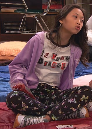 Ivy's purple velour zip jacket and green chunky sneakers on Ravens Home