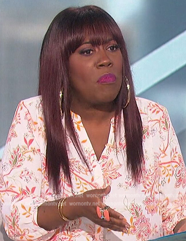 Sheryl's white floral blouse