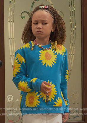 Alice's blue sunflower print sweatshirt on Ravens Home