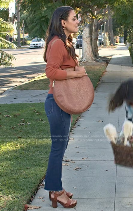 Amy's orange knit top and jeans on Maggie