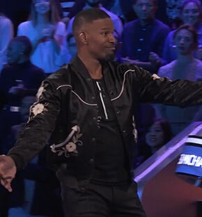 Jamie's black floral bomber jacket on Beat Shazam