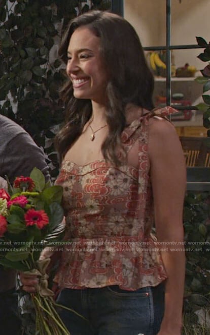 Jessie's floral peplum top with tie straps on Maggie