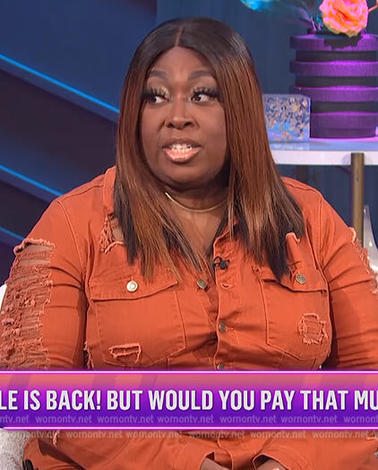 Loni's orange distressed denim jumpsuit on E! News Nightly Pop