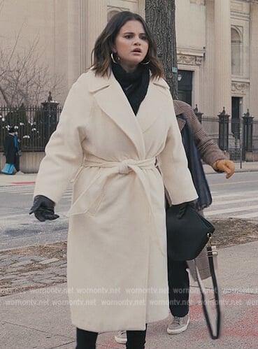 Mabel's white trench coat on Only Murders in the Building