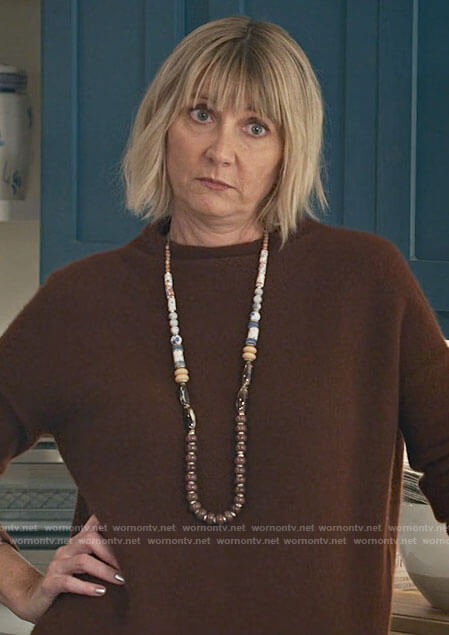 Maria's brown sweater on Maggie