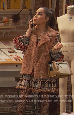 Nikki's printed smocked mini dress on Ravens Home