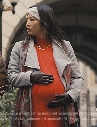 Nina's gray wrap coat on Only Murders in the Building