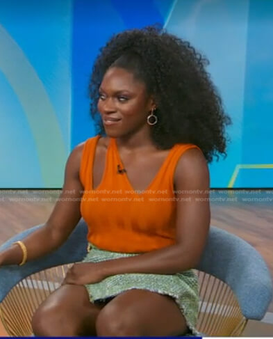 Nkeki Obi-Melekwe's orange top and green tweed skirt on Good Morning America