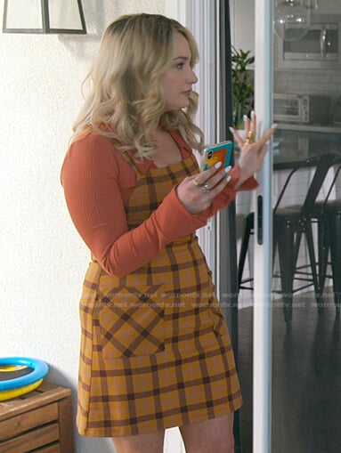Davia's orange check pinafore dress on Good Trouble