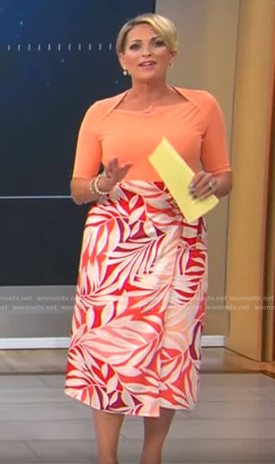 Jamie Yuccas's orange top and leaf print skirt on CBS Mornings