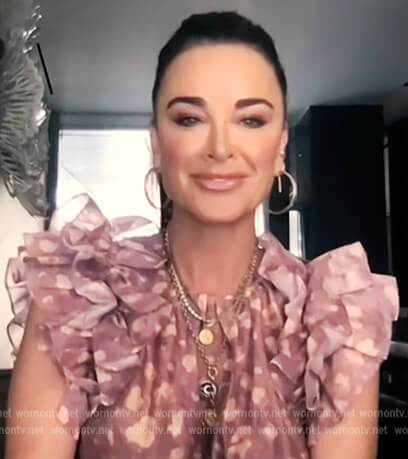 Kyle Richards' purple printed top with ruffle sleeves on E! News Daily Pop