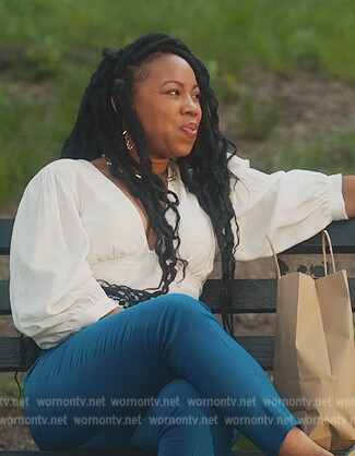 Malika's white puff sleeve top on Everythings Trash