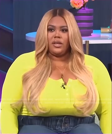 Nina's yellow henley top on E! News Nightly Pop