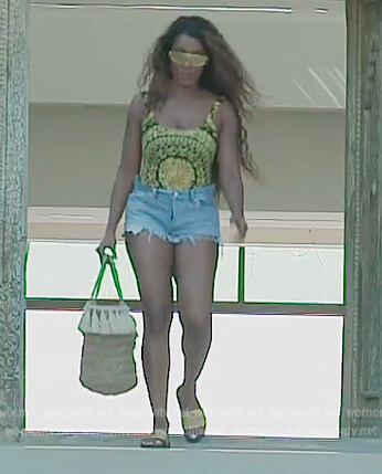 Caroline's baroque print swimsuit and bag on The Real Housewives of Dubai