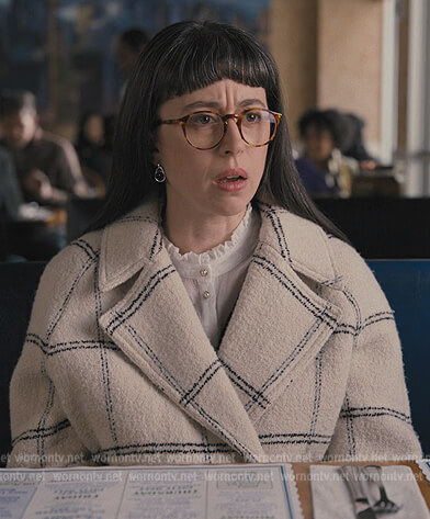 Poppy's white checked coat on Only Murders in the Building