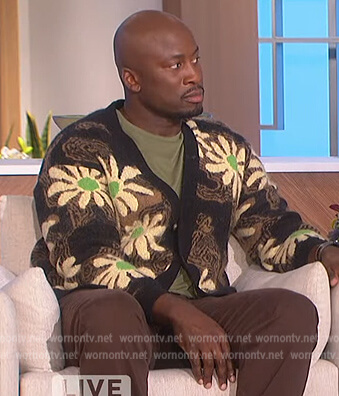 Akbar's black floral print cardigan on The Talk
