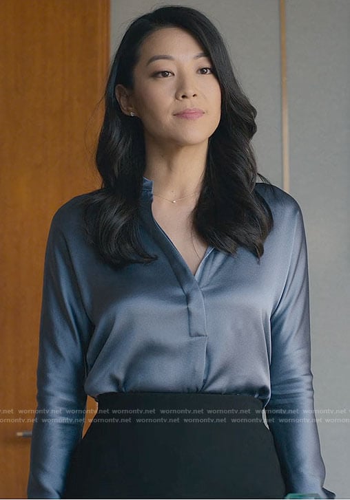 Ingrid's blue satin blouse on Partner Track