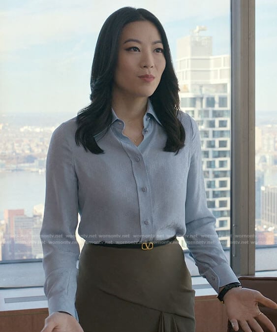 Ingrid's blue button up blouse and olive draped skirt on Partner Track