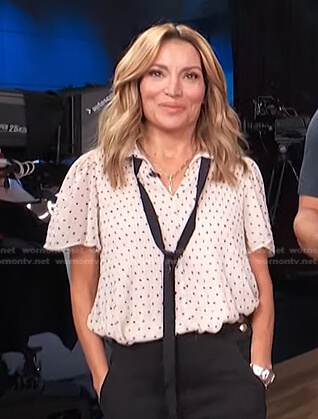Kit's white polka dot tie neck top on Access Hollywood